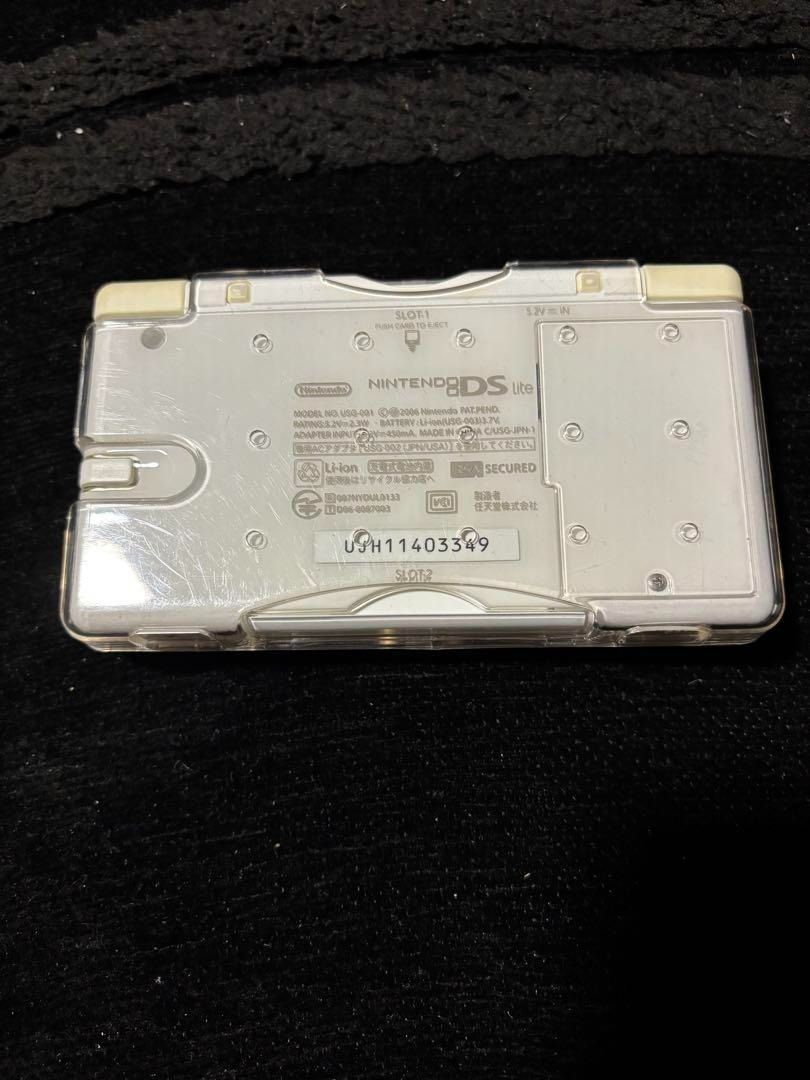 Nintendo DS Lite White with charger and case (Category: Nintendo) located in Manila. Submitted by japan_treasure (Listing ID 1350065766, Image 3). Description: White Nintendo DS Lite with stylus (non-genuine). Comes with charger and a worn out case. Operation confirmed. The main unit is in a clear case, and I don't know how to remove the clear case, so I am selling it as is. There is a film attached to the LCD. The touch pen is non-genuine and ex