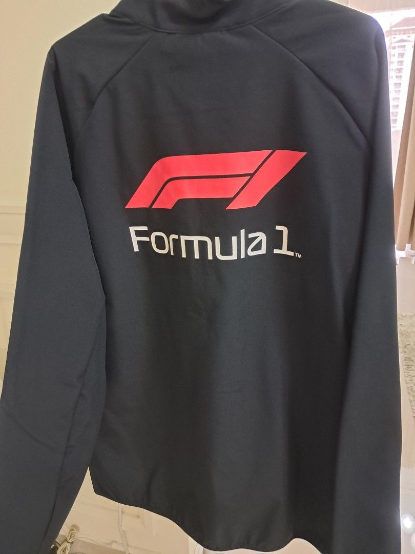 Formula 1 Softshell Jacket (Category: Coats, Jackets and Outerwear) located in Kuala Lumpur. Submitted by mama7781 (Listing ID 1350163167, Image 2). Description: Genuine F1 official merchandise with tags and plastic packaging. Colour black. Size UK L. Bought directly from Germany..