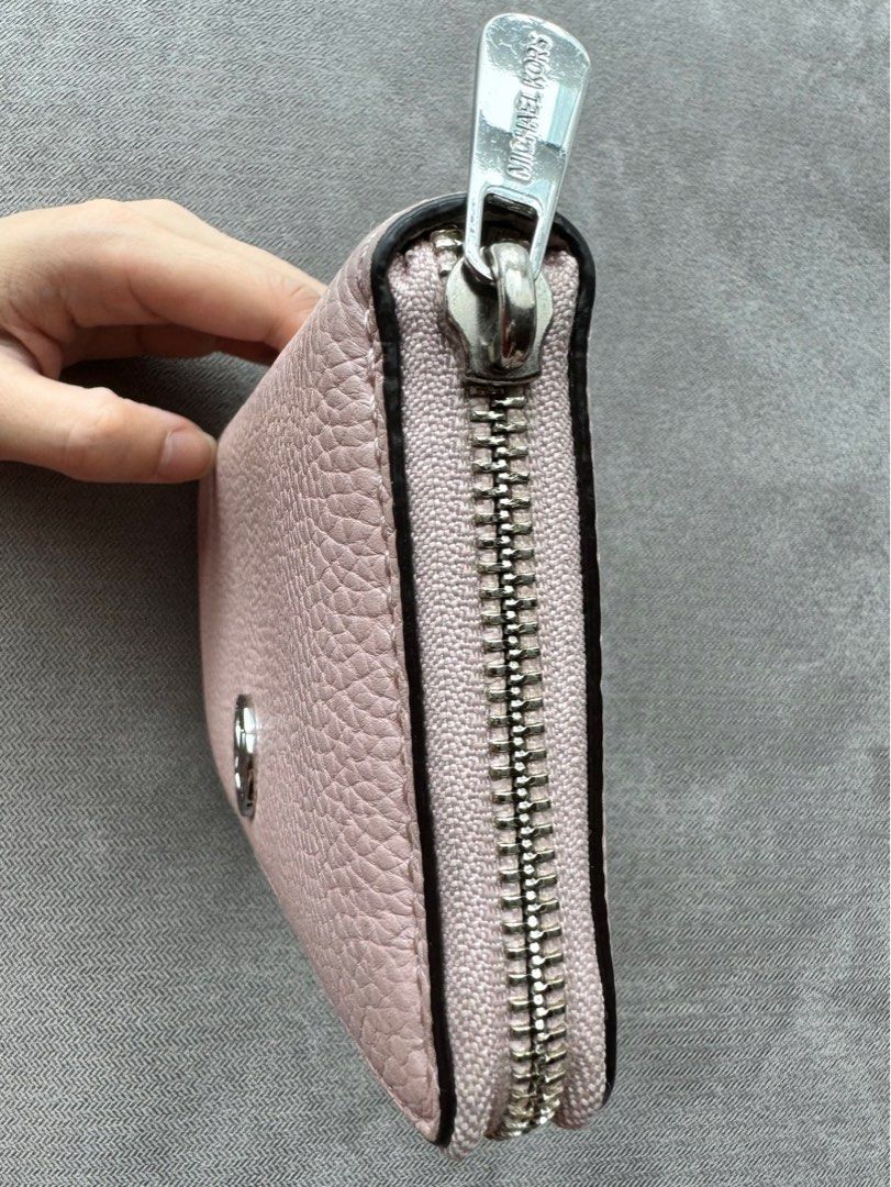Michael Kors MK Blush Long Wallet (Preloved) (Category: Luxury Bags & Wallets) located in Quezon City. Submitted by __J__ (Listing ID 1350130945, Image 3). Description: Preloved original Michael Kors pebbled leather zip around long wallet. The interior is lined with Michael Kors signature lining. There are 8 small credit card slots, 2 large slip pockets on each side, and a coins zipper pocket. Approximately 8”l x 4”h. Condition: Used with care, w