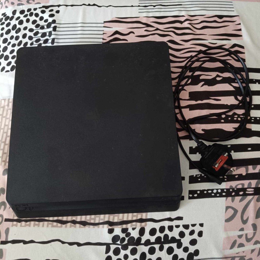 PS4 Slim 1TB (Category: PlayStation) located in Quezon City. Submitted by magmacastles (Listing ID 1350090712, Image 2). Description: Working. Complete package with games. With 2 original controllers, 1 black original with box, 1 blue bought. Black controller both joysticks has no rubber grip. Four games included, Gran Turismo Sport, F1 2020, God of War and Horizon: Zero Dawn. Original bith power cable & controller charger. Disclaimer: 3month pla