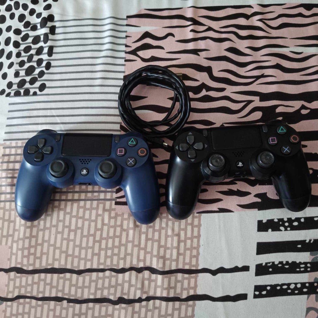PS4 Slim 1TB (Category: PlayStation) located in Quezon City. Submitted by magmacastles (Listing ID 1350090712, Image 3). Description: Working. Complete package with games. With 2 original controllers, 1 black original with box, 1 blue bought. Black controller both joysticks has no rubber grip. Four games included, Gran Turismo Sport, F1 2020, God of War and Horizon: Zero Dawn. Original bith power cable & controller charger. Disclaimer: 3month pla