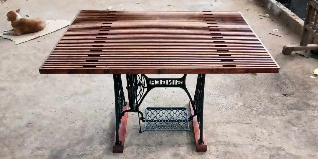 Slatted Table top in sewing machine stand (Category: Tables & Sets) located in Rizal. Submitted by mommykiee (Listing ID 1350126322, Image 2). Description: Old Sewing Machine Stand repurposed into table Table top made of slatted narra wood Size: L45 W33 H30inch Newly stripped & varnished Ready to use.