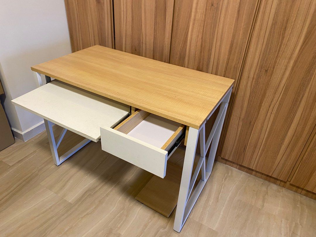 Study Table (Category: Tables & Sets) located in Singapore. Submitted by gleefulturkey (Listing ID 1350130819, Image 3). Description: Still very sturdy and in very good condition as in the photo. Bought but never really used. Selling as moving house soon. 100cm X 54cm X 75cm. Comes with slot for keyboard, drawer and a platform to place CPU. Looking for quick deal. .