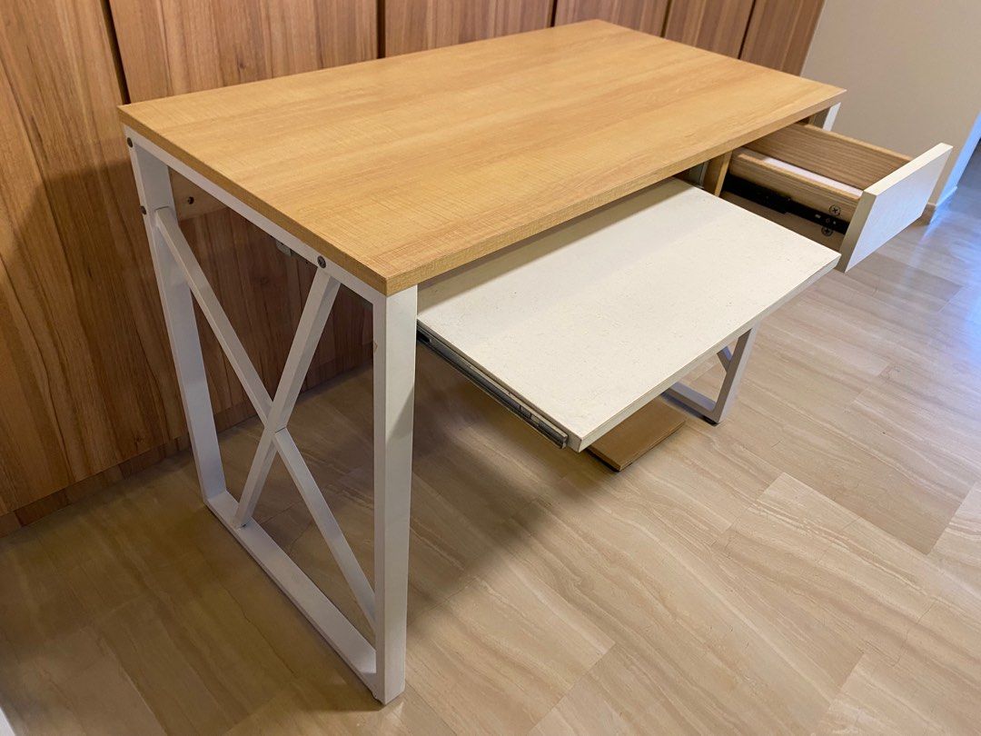 Study Table (Category: Tables & Sets) located in Singapore. Submitted by gleefulturkey (Listing ID 1350130819, Image 2). Description: Still very sturdy and in very good condition as in the photo. Bought but never really used. Selling as moving house soon. 100cm X 54cm X 75cm. Comes with slot for keyboard, drawer and a platform to place CPU. Looking for quick deal. .