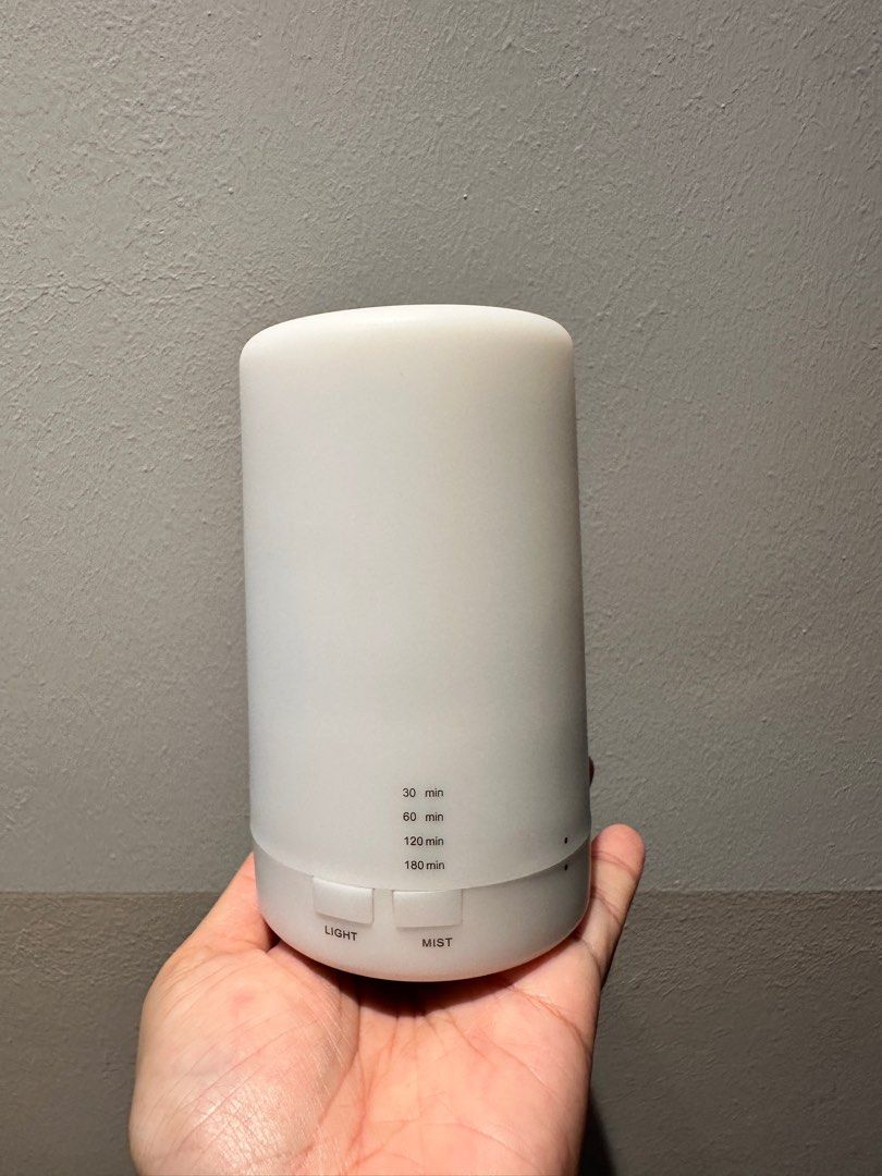 Aroma Diffuser Small (Category: Home Fragrance) located in Singapore. Submitted by tdyxy14 (Listing ID 1345143672, Image 1). Description: Like brand new, used a few times only Capacity is about 100-125ml Perfect for small desk space Water humidifier/diffuser RTP $15 Comes with usb wire No nego Only available with tracked letterbox shipping @ $2.20.