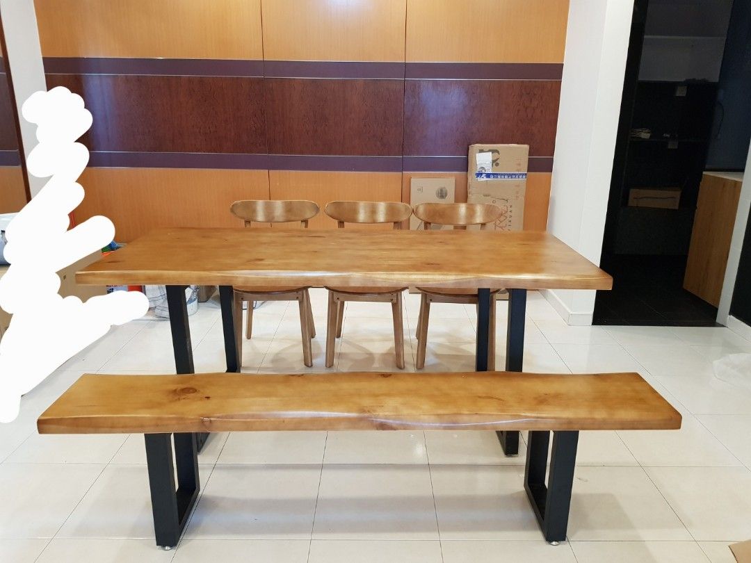 Dining Table (Category: Tables & Sets) located in Singapore. Submitted by ay93_preloved (Listing ID 1345141506, Image 2). Description: Solid wood dining table with 4 chairs and 1 long bench VERY HEAVY please arrange more than 2 persons to assist with transportation. self collection only at 670480.