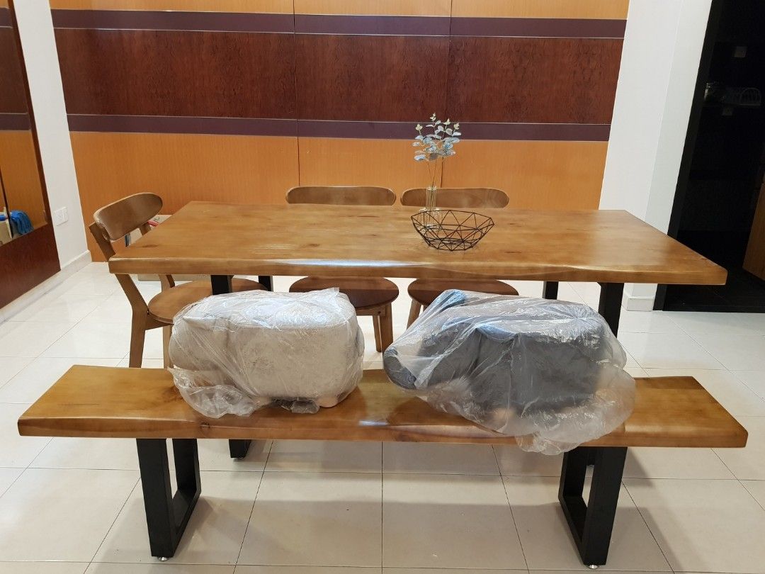 Dining Table (Category: Tables & Sets) located in Singapore. Submitted by ay93_preloved (Listing ID 1345141506, Image 1). Description: Solid wood dining table with 4 chairs and 1 long bench VERY HEAVY please arrange more than 2 persons to assist with transportation. self collection only at 670480.
