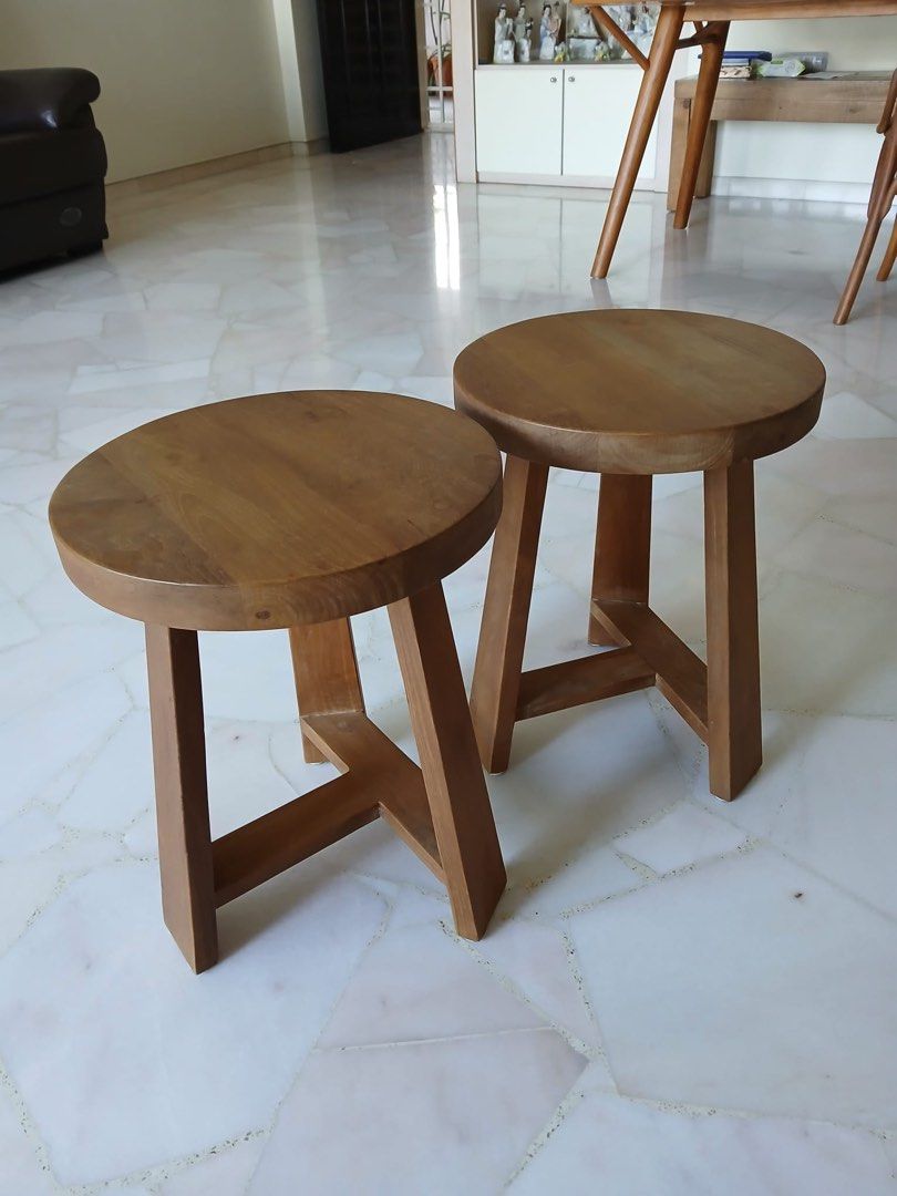 Handcrafted solid wool stool (Category: Chairs) located in Singapore. Submitted by aliceho16 (Listing ID 1345168314, Image 2). Description: Handcrafted solid wood stool, specially shipped in from a famous store in Indonesia. In excellent condition, this nail-free, sturdy piece is being sold due to the addition of a small child at home. A unique, durable, and beautiful item to elevate any space. Diameter 35cm x 45cm Height.