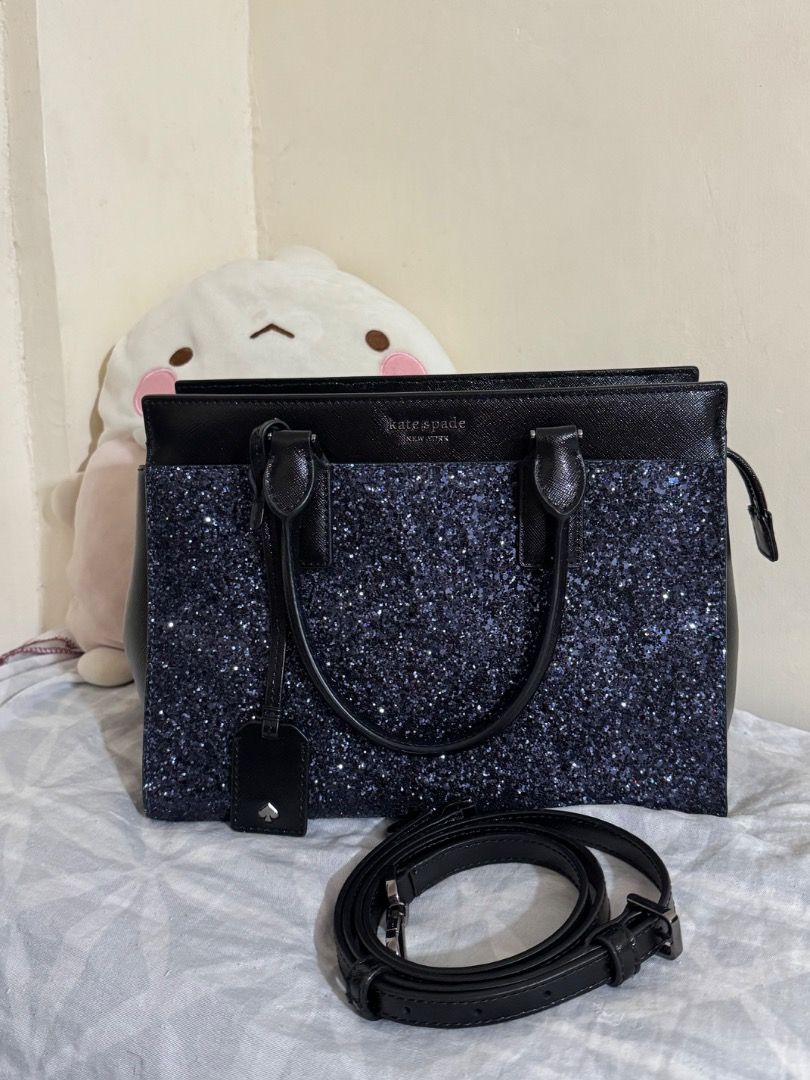 Kate Spade 2 way glittery midnight blue (Category: Cross-body Bags) located in Subic. Submitted by e-clutter (Listing ID 1345248520, Image 1). Description: - like new condition, wala to syang flaw 🥹 - 2 way hand bag / sling - office bag practical size - textured glitter design but not shedding PM for inquiries..