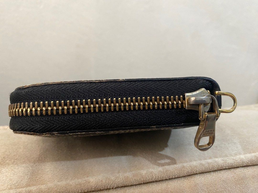 Loewe anagram long wallet (Category: Luxury Bags & Wallets) located in Cebu City. Submitted by janb85 (Listing ID 1345137809, Image 3). Description: Lp posted Authentic Printed Canvas material - hard wearing Bought in Japan Lots of card slots and bill compartments Only callout is the faded zipper puller Interior is clean no issues Coded of course No other inclusions.
