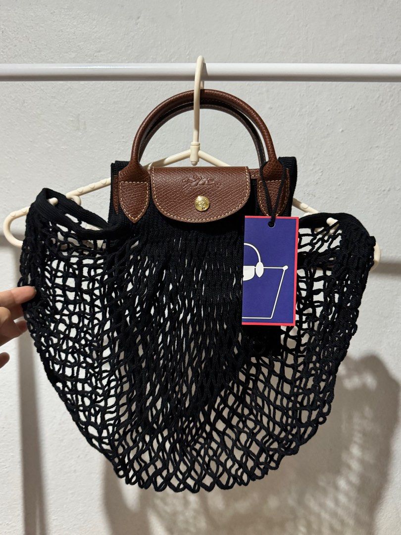 LONGCHAMP Le Pliage Filet Large Mesh Bag (Category: Luxury Bags & Wallets) located in Bacolod City. Submitted by usedbyc (Listing ID 1345217143, Image 1). Description: LONGCHAMP Le Pliage Filet Large Mesh Bag (Large size using the old sizing names) Color Black Brandnew with tags Guaranteed Original Inner cloth not included Php 6,000 only.