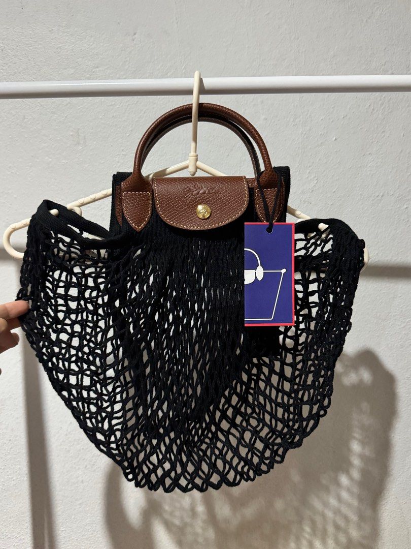 LONGCHAMP Le Pliage Filet Large Mesh Bag (Category: Luxury Bags & Wallets) located in Bacolod City. Submitted by usedbyc (Listing ID 1345217143, Image 2). Description: LONGCHAMP Le Pliage Filet Large Mesh Bag (Large size using the old sizing names) Color Black Brandnew with tags Guaranteed Original Inner cloth not included Php 6,000 only.