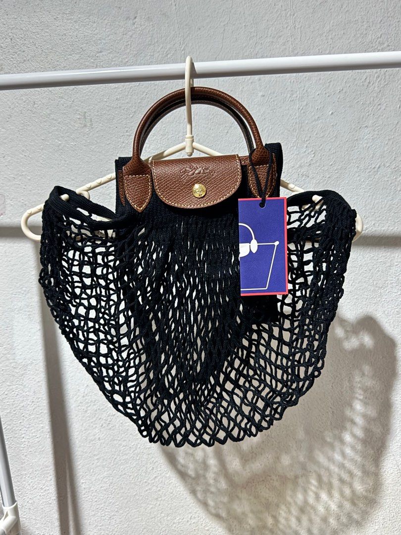 LONGCHAMP Le Pliage Filet Large Mesh Bag (Category: Luxury Bags & Wallets) located in Bacolod City. Submitted by usedbyc (Listing ID 1345217143, Image 3). Description: LONGCHAMP Le Pliage Filet Large Mesh Bag (Large size using the old sizing names) Color Black Brandnew with tags Guaranteed Original Inner cloth not included Php 6,000 only.