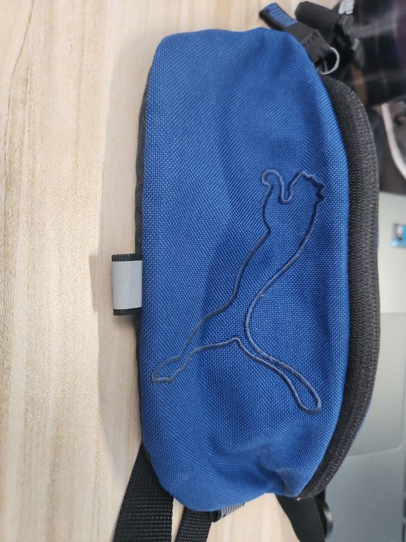 Puma pouch (Category: Belt bags, Clutches and Pouches) located in Singapore. Submitted by baka_chan22 (Listing ID 1345159921, Image 2). Description: Selling since no longer in use. Used a few times. still in good condition Size: A5 book Original price:$40.