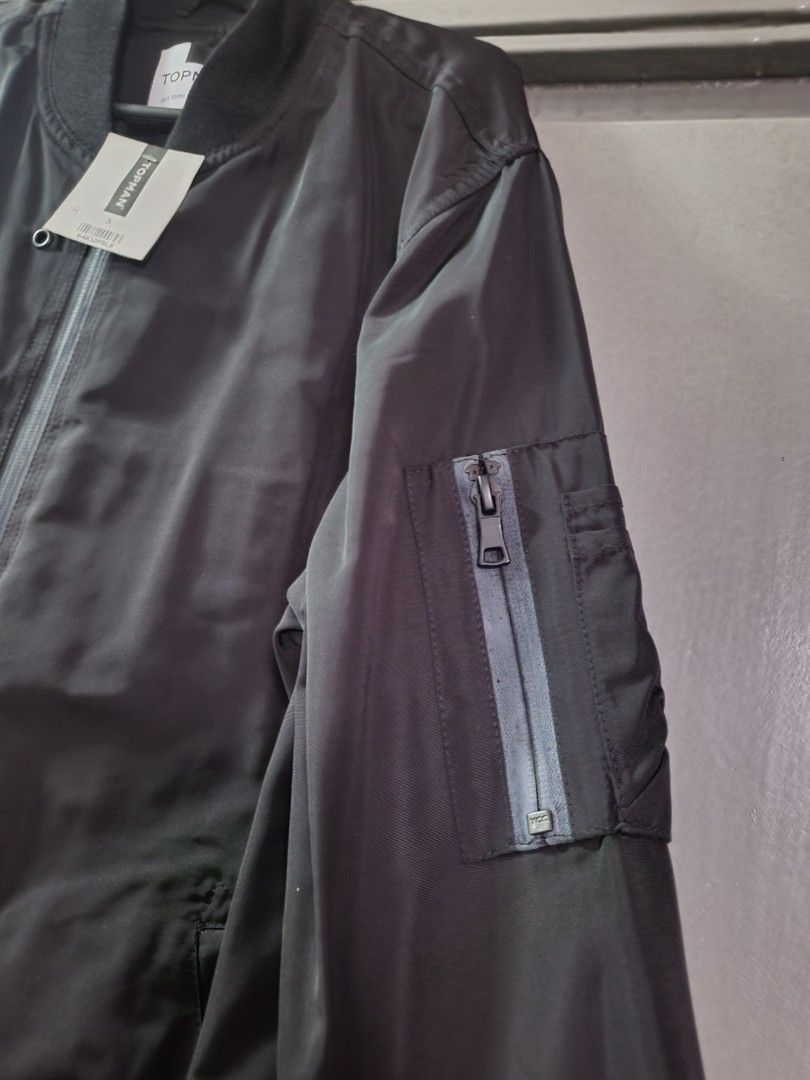 Topman bomber jacket (Category: Coats, Jackets and Outerwear) located in Pasig City. Submitted by good.deal.yan (Listing ID 1345183735, Image 2). Description: brand new original Topman bomber jacket size: small-medium condition: 10/10 color: black price: 900 pesos (firm) pasig city.