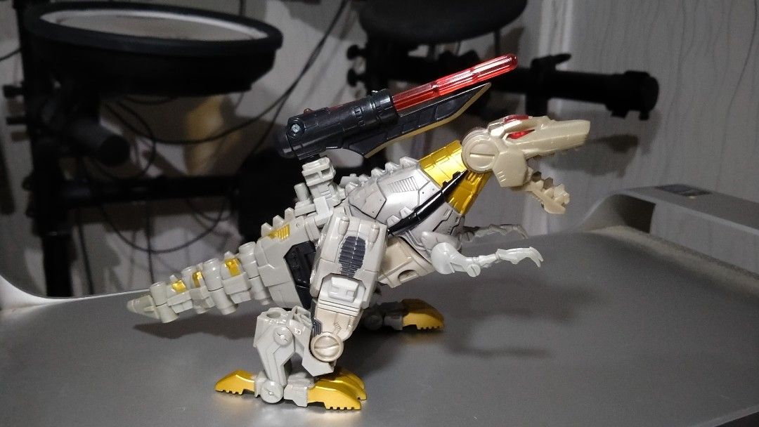 Transformers Deluxe Classic - Grimlock (Category: Action & Battle Toys) located in Pasay City. Submitted by silentbear_c00b58 (Listing ID 1345262346, Image 2). Description: Transformers Deluxe Classic - Grimlock Released: From the Transformers Classics line (2006) Condition: Slightly used Includes: Manual (no box) Features: All parts complete, missile launcher fully functional This Grimlock figure from the Transformers Classics line is a must-hav