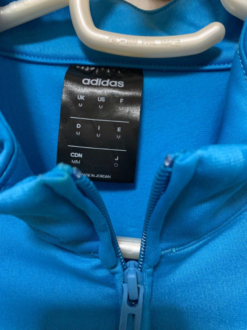 Authentic ADIDAS TRACK SUIT (Top & Pants) (Category: Sets & Coordinates) located in Muntinlupa City. Submitted by arisofcalico (Listing ID 1350289672, Image 3). Description: Authentic Adidas track suit Size US Medium (both sizes) Unique color combination (Reverse color style on stripes and fabric) Light blue and dark grey reversed on jacket & trousers Made in Jordan & Cambodia Unisex fit Chest size: 20 inches Waist (tousers): 33 inches (Garterize