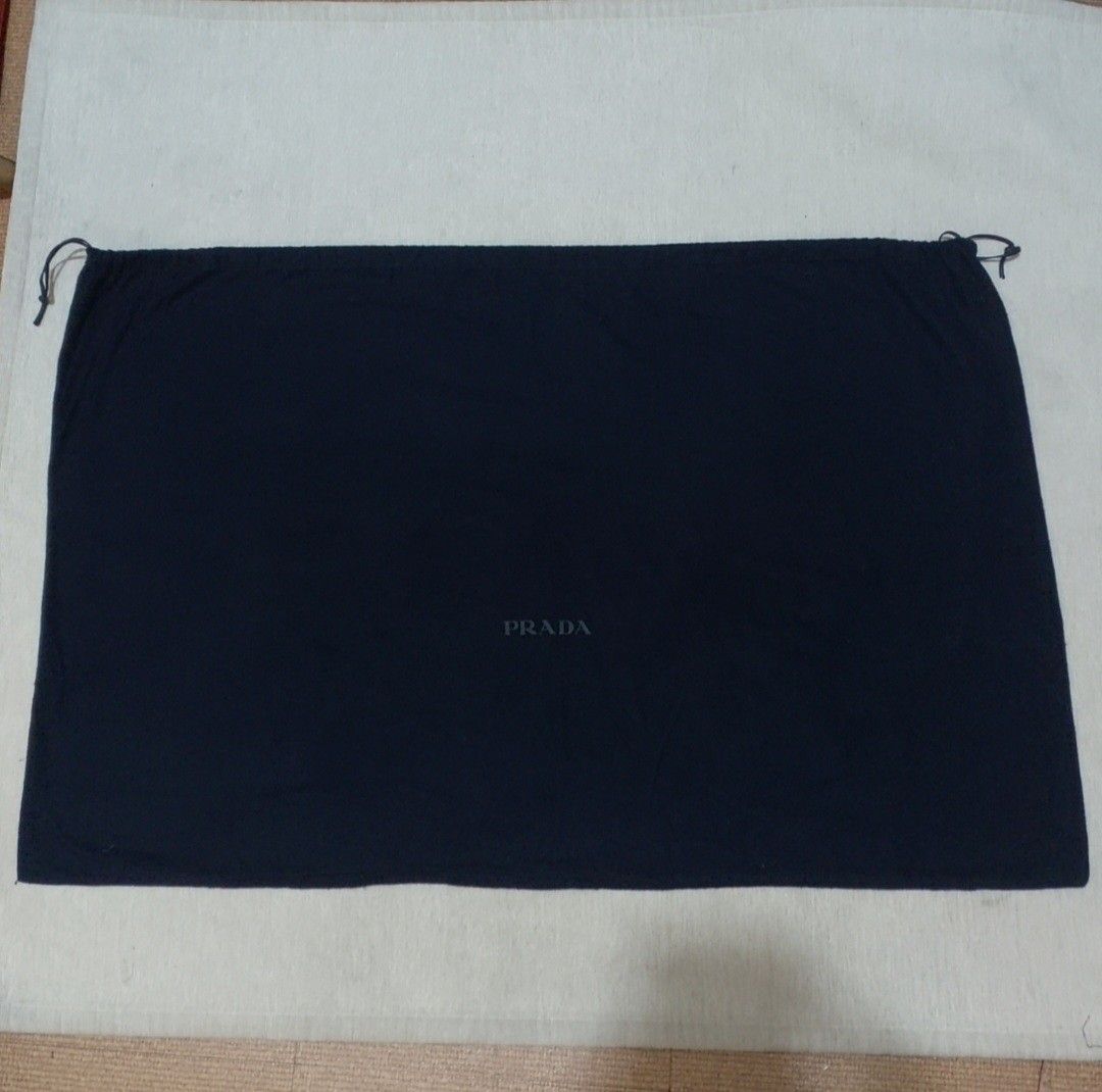 Authentic Prada dust bag 23x35 inches (Category: Luxury Bags & Wallets) located in Manila. Submitted by jfluxury.co (Listing ID 1350279382, Image 3). Description: excellent condition no flaws bought in Japan 🇯🇵 💯% Authentic. 😊 Money back guarantee. 😊 Clean and ready to use na.