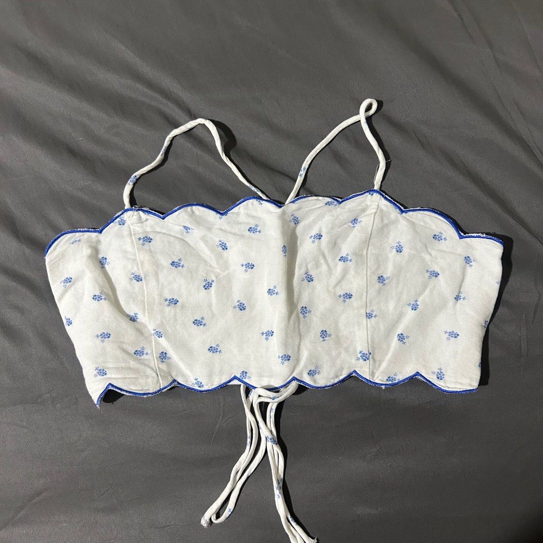 Blue white floral scallop top (Category: Sleeveless) located in Quezon City. Submitted by p0lingkit (Listing ID 1350242115, Image 1). Description: • see pic for measurement • fabric is soft, not sure if its cotton or linen • i dont use it anymore • no when worn • strap is adjustable Not sure if zara or h&m hehe.