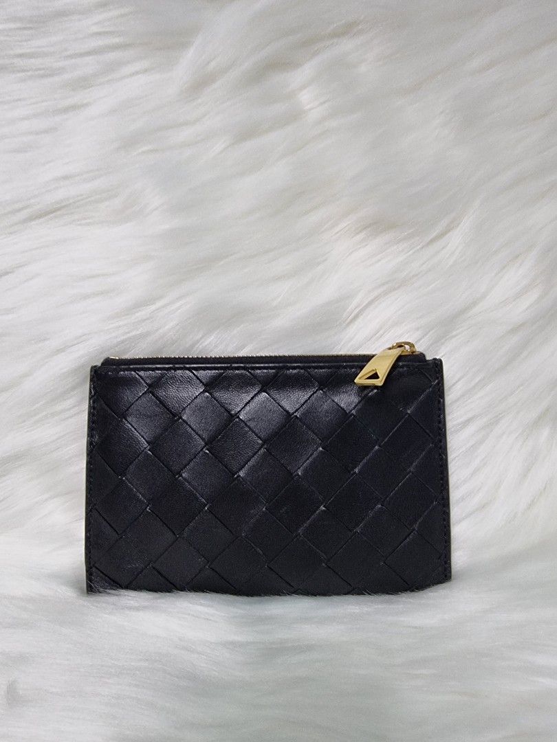 Bottega Venetta Intrecciato Medium Bi-Fold Wallet (Category: Luxury Bags & Wallets) located in Manila. Submitted by facet.ornament (Listing ID 1350369821, Image 2). Description: Bottega Veneta Intreciatto Authentic 👜💯🪭 BV Intrecciato Medium Bi-Fold Wallet A bi-fold wallet with six card slots, a zippered coin pocket and a cash compartment. Material: Lambskin Lining: Calfskin Color: Black Six card slots, one bill compartment, two additional pock