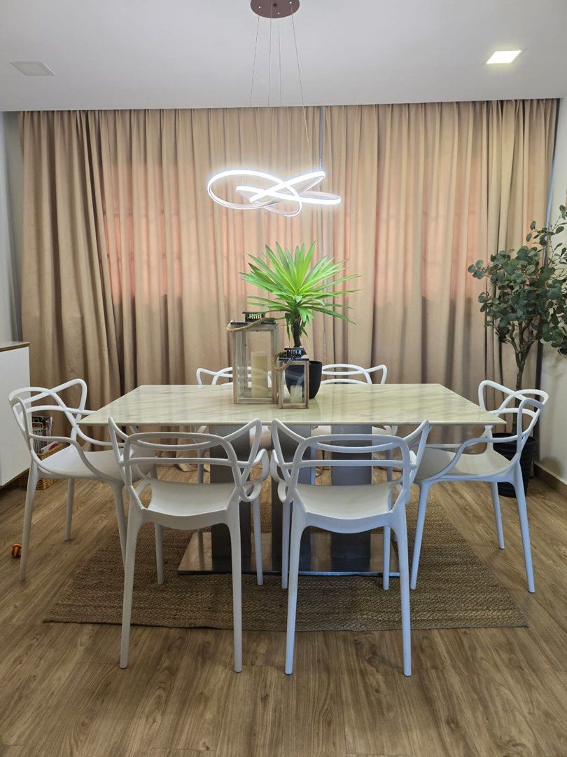Dining Table Set (Category: Tables & Sets) located in Singapore. Submitted by 008iilt (Listing ID 1350280204, Image 3). Description: Marble Table with stainless steel legs Note that the stainless steel legs can be cleaned by polishing and small chip on table. Measurements: 160cm x 80.5cm x 50cm Comes with 6 white chairs .
