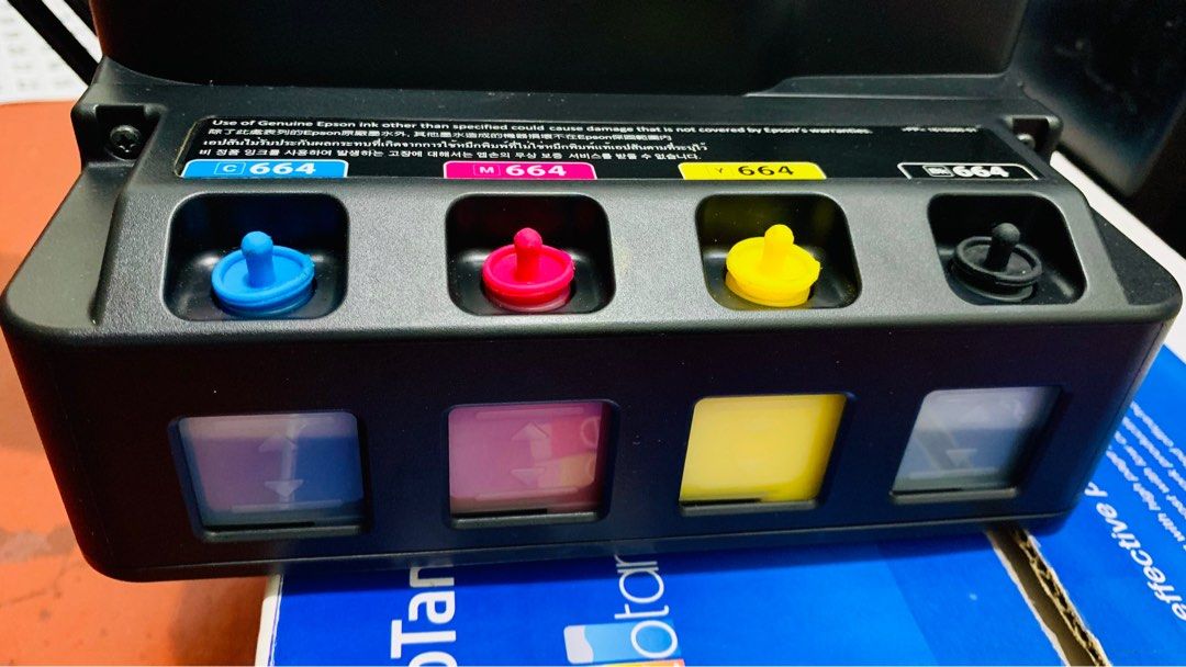 Epson L121 Converted to Pigment (Category: Printers, Scanners & Copiers) located in Quezon City. Submitted by cedric.shin (Listing ID 1350282655, Image 2). Description: ✅ Bought from Epson Official Store ✅ Complete Accessories with Box ✅ Already Romoved Sharkteeth ✅ Converted to Pigment once nung binili ko, pigment agad nilagay ko.. (L&C Pigment Inks) ✅ with Paper Catcher ✅ with Dust Cover ✅ with 4 Brandnew L&C Pigment Inks (Sealed) ✅ full tank a