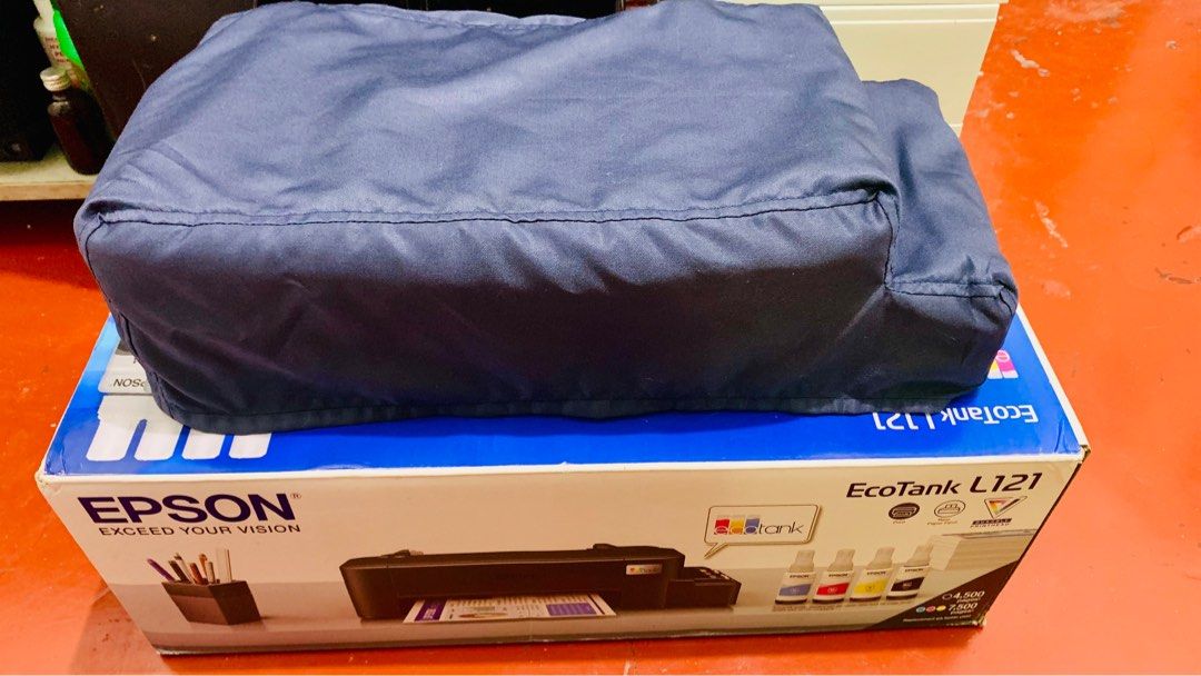 Epson L121 Converted to Pigment (Category: Printers, Scanners & Copiers) located in Quezon City. Submitted by cedric.shin (Listing ID 1350282655, Image 3). Description: ✅ Bought from Epson Official Store ✅ Complete Accessories with Box ✅ Already Romoved Sharkteeth ✅ Converted to Pigment once nung binili ko, pigment agad nilagay ko.. (L&C Pigment Inks) ✅ with Paper Catcher ✅ with Dust Cover ✅ with 4 Brandnew L&C Pigment Inks (Sealed) ✅ full tank a