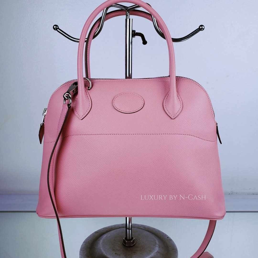Hermes Bolide 27 Bubblegum Epsom (Category: Luxury Bags & Wallets) located in Quezon City. Submitted by luxury_by_n-cash (Listing ID 1350245463, Image 3). Description: N-Cash Pawnshop "Instant Cash for Bags, Watches, Cars, and Electronics" https://www.ncash-pawnshop-philippines.com/ Hermes Bolide 27 Bubblegum Epsom PRE-OWNED Material: Bubblegum Epsom Hardware: Palladium Made in France Stamp: X ITEM INCLUSIONS Detachable Strap, Dust Bag, and Lock 