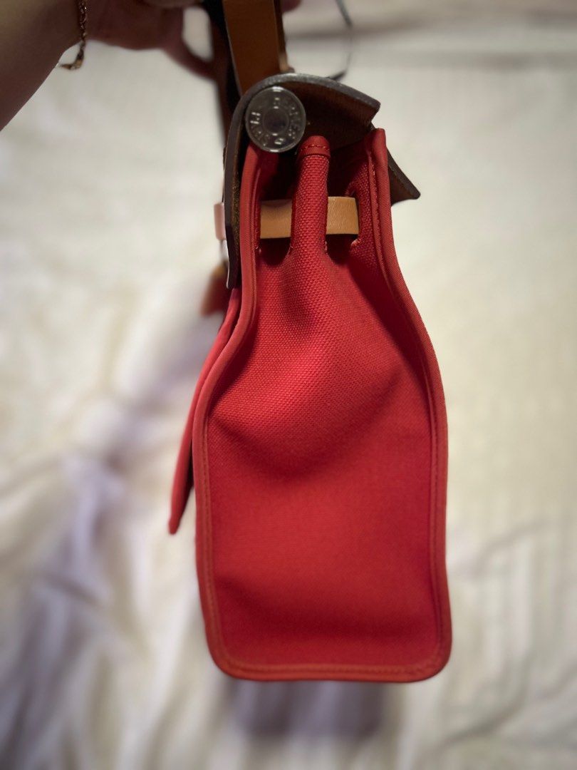 Hermes Herbag 31 Rouge PHW (Category: Bags & Wallets) located in Singapore. Submitted by acathelizabeth (Listing ID 1350285696, Image 3). Description: 💯 Authentic Hermes Herbag 31 Rouge PHW ♥️ Perfect bag for casual. The color pop out with your outfit 😍 Comes with complete keys, clochette, extra pouch. Clean interior. No smell. No stains. Priced reasonably already - to give space to my wardrobe Fast deal only. Lowballers will be blocked. RFS : 