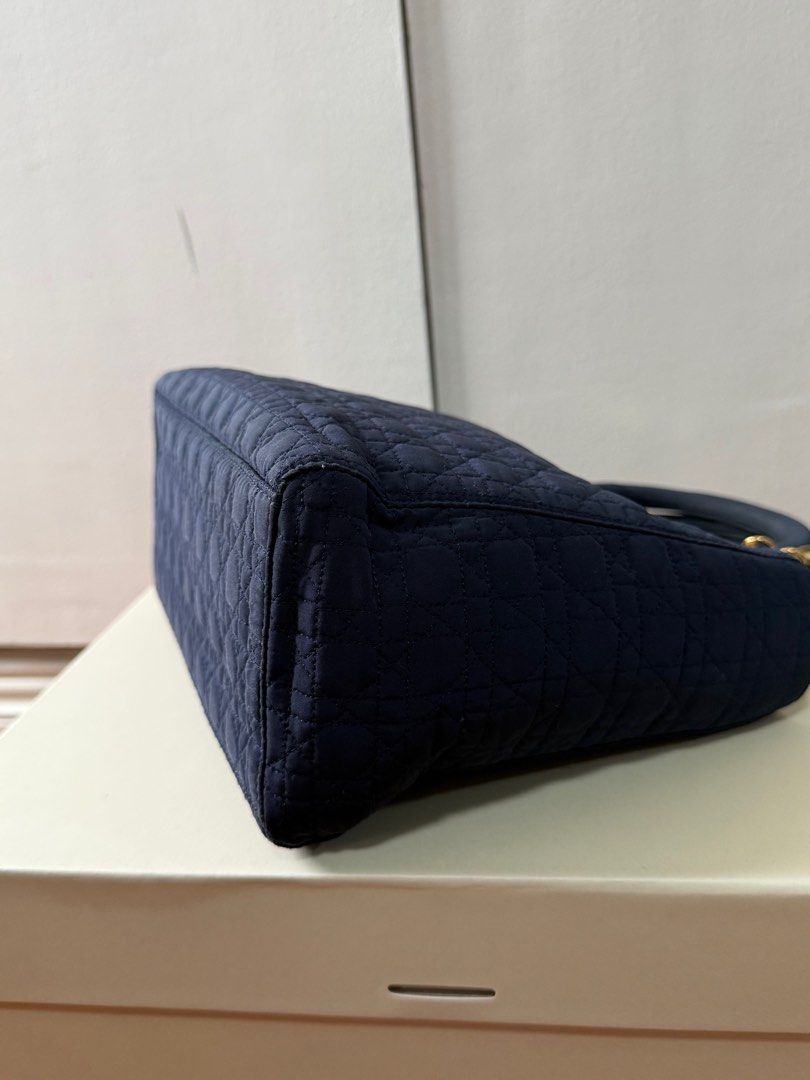 Vintage Lady Dior Bag (Category: Luxury Bags & Wallets) located in San Juan City. Submitted by nnnryo (Listing ID 1350255650, Image 3). Description: - bought in a preloved ig store Japanluxxsale - vintage - well used, please photos of some flaws on the hardware otherwise everything is in good condition - color is navy blue - gold hardware - no strap but could give generic 5cm wide strap - generic dustbag only - i can send more photos.