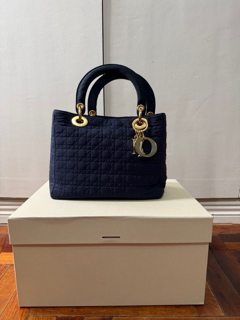 Vintage Lady Dior Bag (Category: Luxury Bags & Wallets) located in San Juan City. Submitted by nnnryo (Listing ID 1350255650, Image 1). Description: - bought in a preloved ig store Japanluxxsale - vintage - well used, please photos of some flaws on the hardware otherwise everything is in good condition - color is navy blue - gold hardware - no strap but could give generic 5cm wide strap - generic dustbag only - i can send more photos.