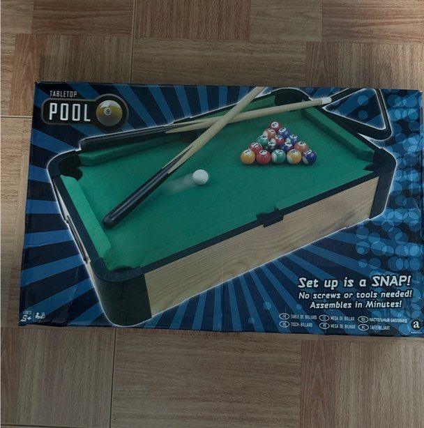 mini pool table (Category: Racket & Ball Sports) located in Singapore. Submitted by aariz93 (Listing ID 1350295384, Image 1). Description: what u see is what u get , comes with balls 2 cue sticks and triangle. nego.