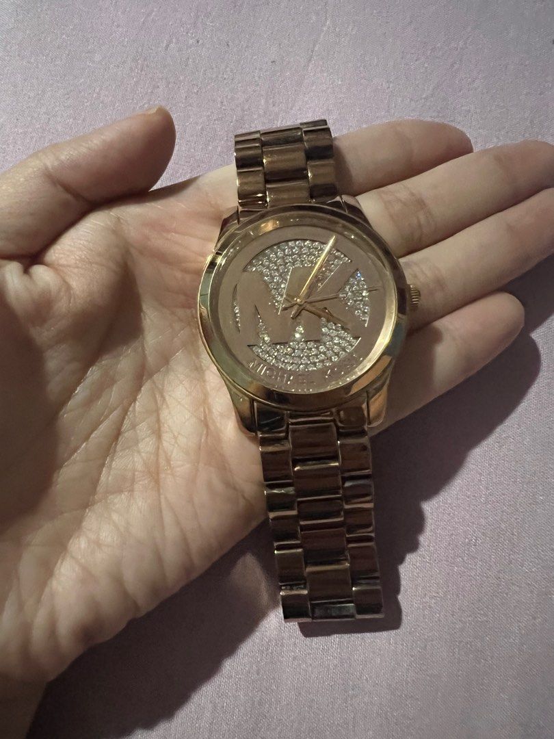 MK rose gold watch (Category: Women's Watches) located in Quezon City. Submitted by mommamd (Listing ID 1350315118, Image 1). Description: Comes with free KS and Coach bangles .