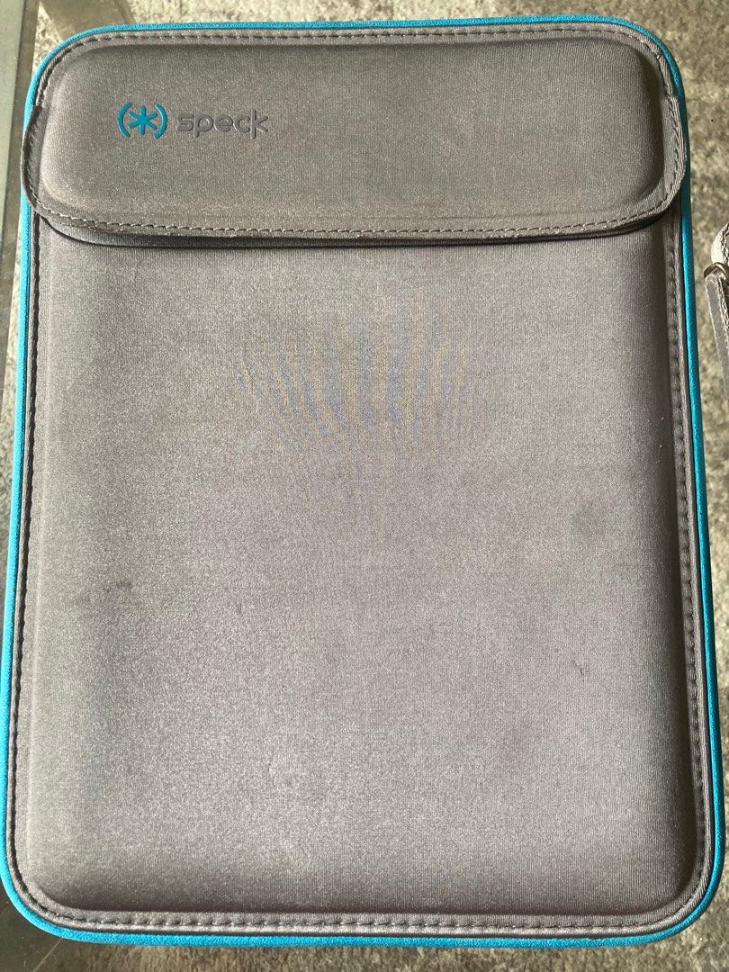 Original SPECK macbook pro laptop sleeve (Category: Cases & Sleeves) located in Mandaluyong City. Submitted by rominagrace (Listing ID 1350275241, Image 1). Description: Original gray with teal color Speck laptop sleeve (macbook pro) , sturdy and soft to the touch.