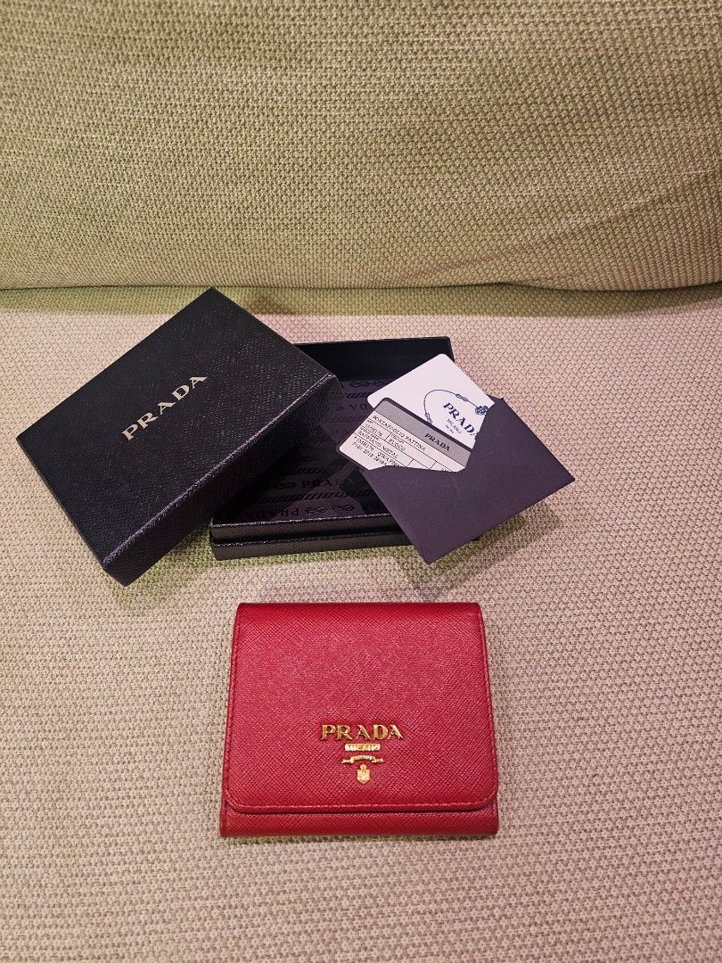 Prada Saffiano Leather Trifold Wallet (Category: Luxury Bags & Wallets) located in Quezon City. Submitted by ten.ten2504 (Listing ID 1350330043, Image 2). Description: Prada Saffiano Leather Red Trifold Wallet Condition: Excellent, like new Inclusion: Box, authenticity card.
