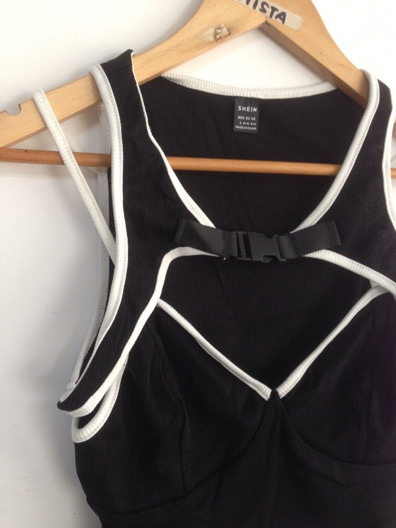 Shein Buckle Cut Out Front Croptop (Category: Sleeveless) located in San Fernando. Submitted by hellokteesph (Listing ID 1350342954, Image 2). Description: Shein brandnew with pouch rare top large on tag.