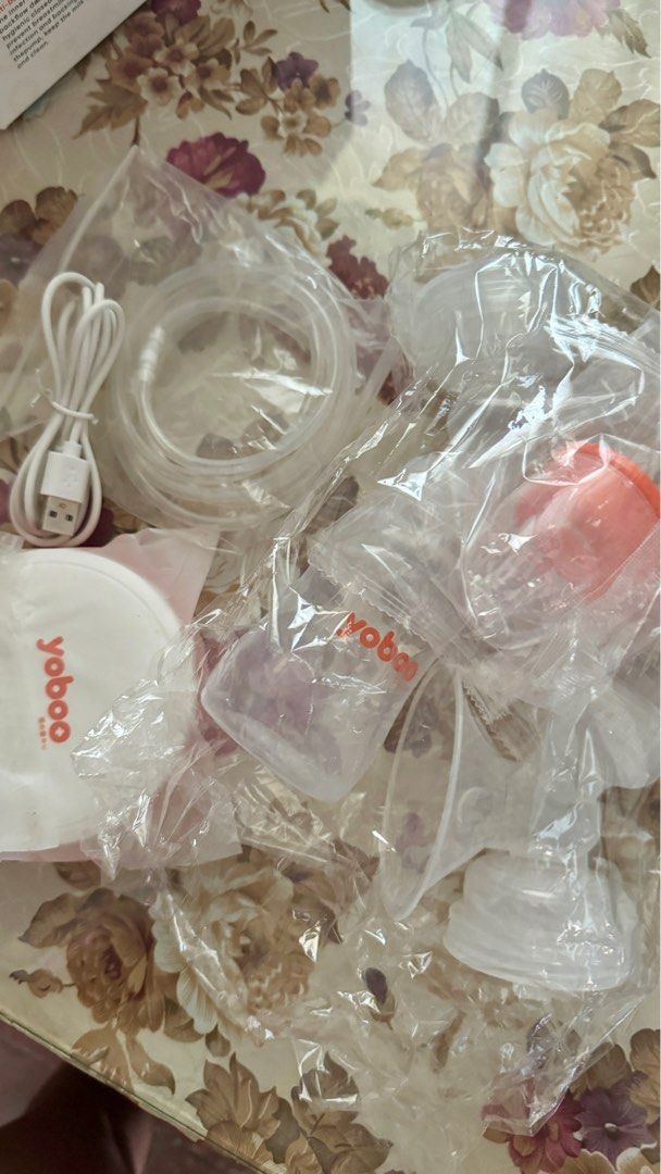Yoboo Double Electric Breast Pump (Category: Breastfeeding & Bottle Feeding) located in Agno. Submitted by ursecondhand_chic (Listing ID 1350234427, Image 2). Description: Used only once. Sterilized, then stored. •Payment via GCash/Maya 💸 •No COD A simple version of a double electric breast pump, suitable for milk expression at home Features: 1. save time and be more efficient. 2. 9-gear massage mode. 3. 9-gear breast pump mode. 4. Design to pre