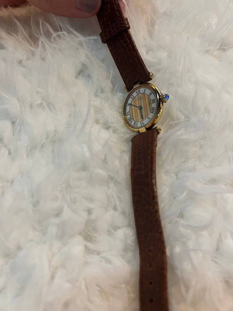 Cartier Must Vendome Trinity 1990 in Brown (Category: Luxury Watches) located in Mandaluyong City. Submitted by forlaughandlemons (Listing ID 1350466043, Image 3). Description: Brown Cartier Must Vendome Trinity 1990 Case diameter: 24mm Bracelet: Aftermarket strap and buckle.