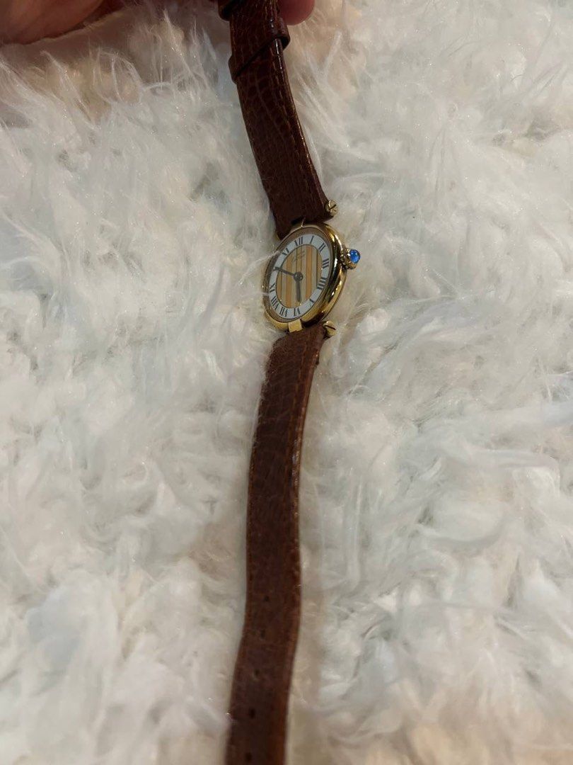 Cartier Must Vendome Trinity 1990 in Brown (Category: Luxury Watches) located in Mandaluyong City. Submitted by forlaughandlemons (Listing ID 1350466043, Image 2). Description: Brown Cartier Must Vendome Trinity 1990 Case diameter: 24mm Bracelet: Aftermarket strap and buckle.