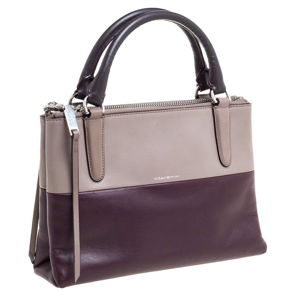 Authentic & New Coach Leather Tote - Perfect for CNY! (Category: Bags & Wallets) located in Singapore. Submitted by cjy91 (Listing ID 1350404608, Image 1). Description: This cute little tote bag is an original and never once used. Chic design and good-sized, not too big and not too small. Colour is in burgundy purple/deep red..