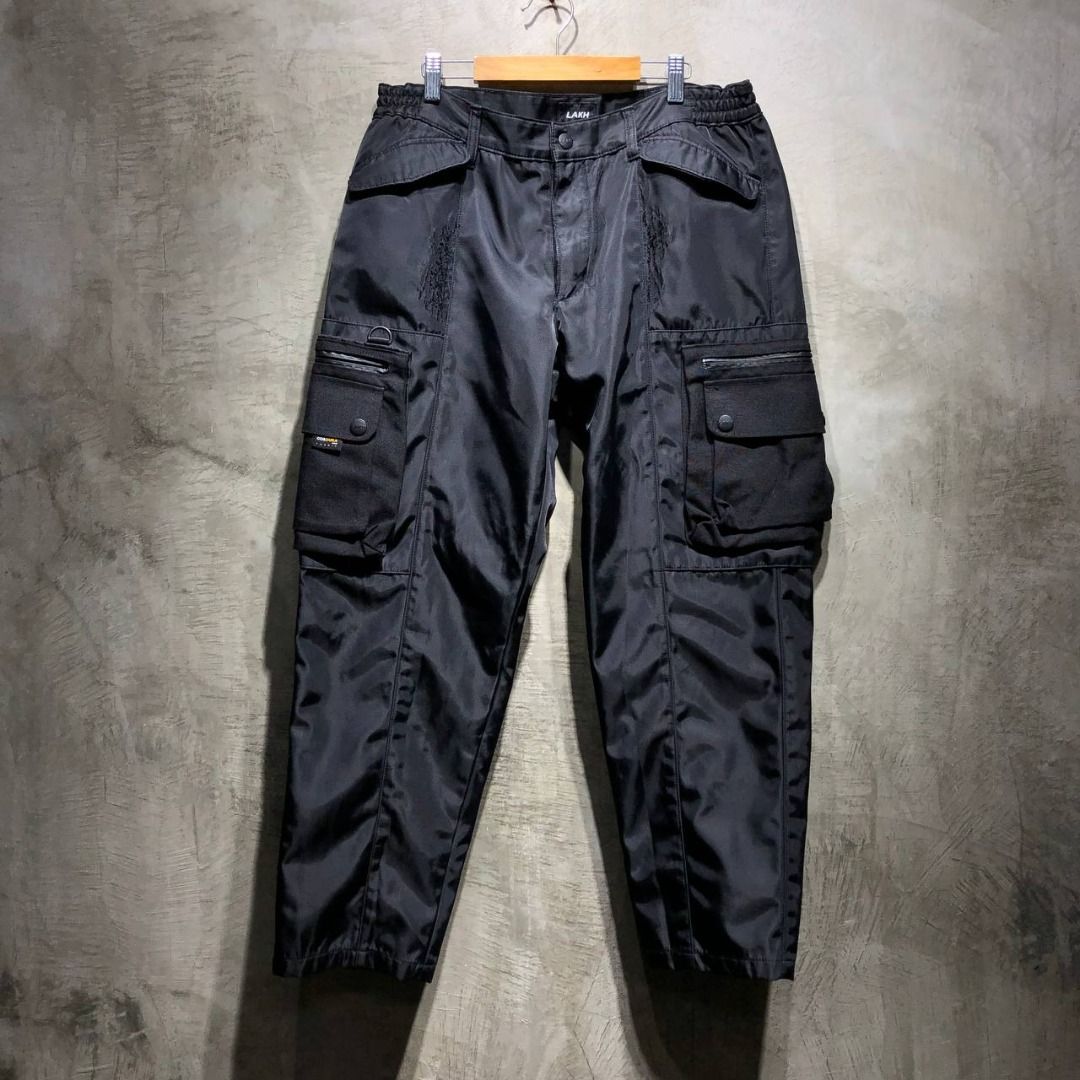 LAKH Supply AW19 Technical pants (Category: Trousers) located in Quezon City. Submitted by johnpaulperezzz (Listing ID 1350471948, Image 1). Description: NAME: LAKH Supply AW19 Technical pants COLOR: Black SIZE: Large on tag FIT: 34 Dimension: Waist: 18 Inseam: 28 Front Rise: 10 Thigh: 12 Knee: 10 Leg Opening: 7 CONDITION: 8.5/10 ISSUE: -signs of usage -scratches PRICE: 3.5k .