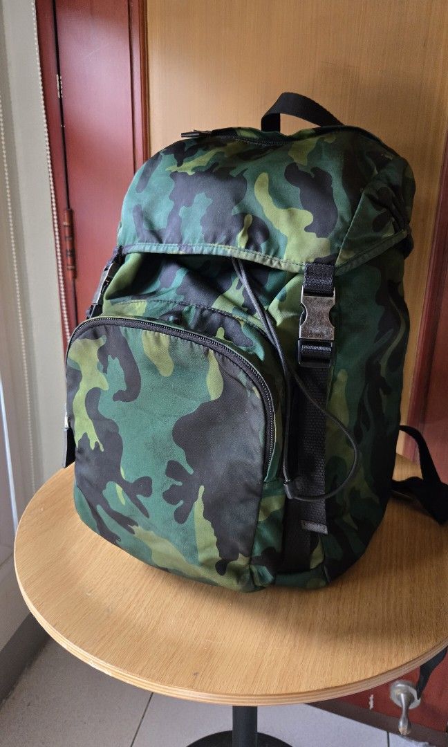 Original Prada Camou Backpack (Category: Luxury Bags & Wallets) located in Makati City. Submitted by mickeypd (Listing ID 1350429776, Image 2). Description: original backpack with dustbag and authenticity card.