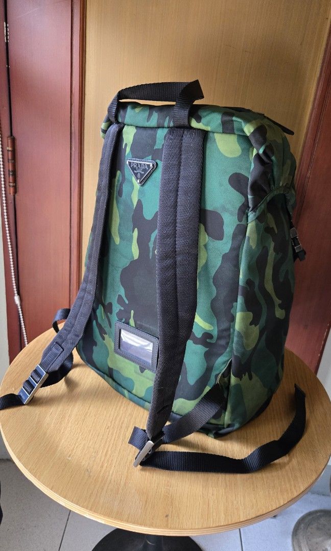 Original Prada Camou Backpack (Category: Luxury Bags & Wallets) located in Makati City. Submitted by mickeypd (Listing ID 1350429776, Image 3). Description: original backpack with dustbag and authenticity card.