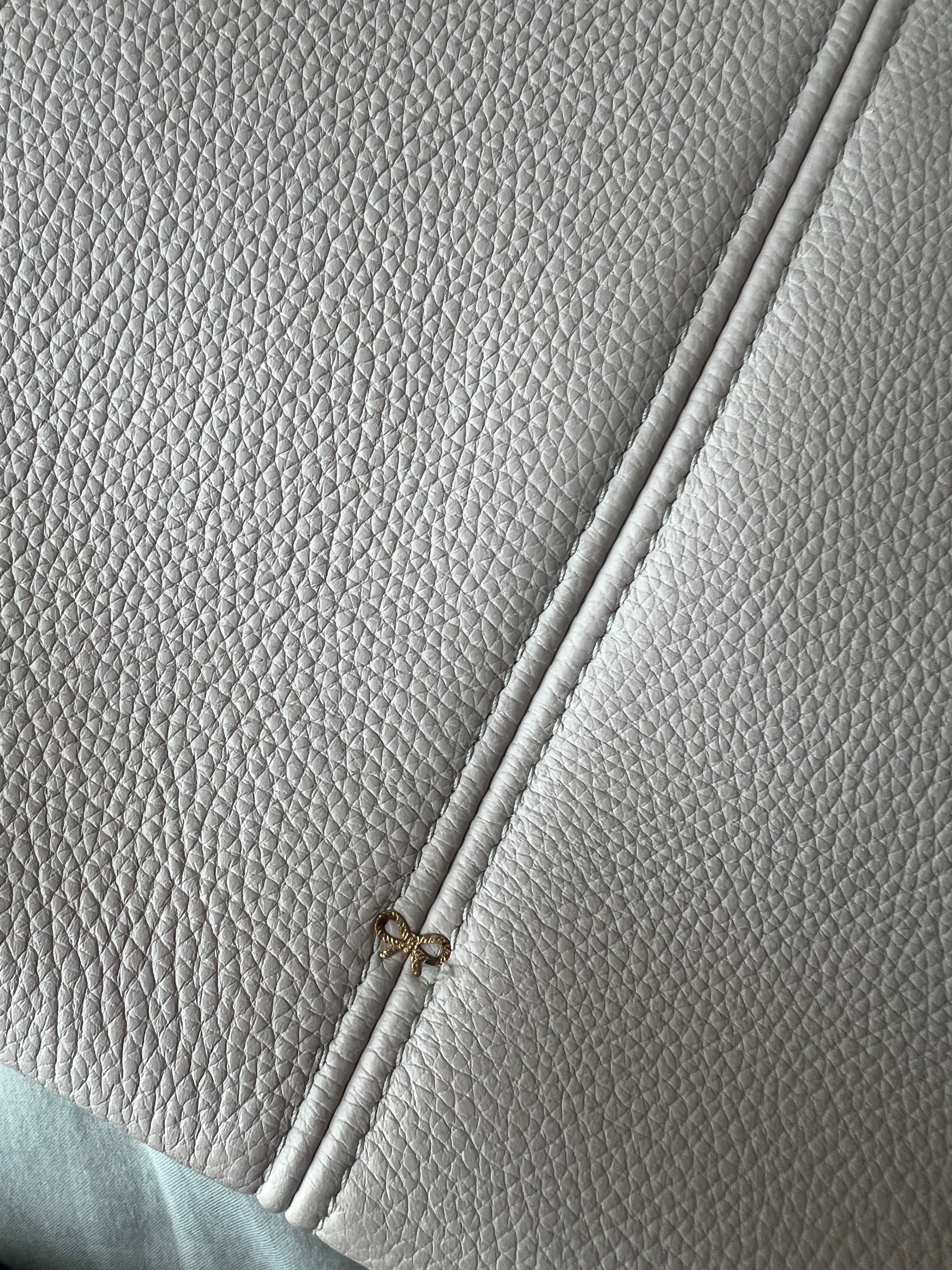 Anya Hindmarch Bag (Category: Bags & Wallets) located in Singapore. Submitted by scd203 (Listing ID 1345404851, Image 2). Description: Anya Hindmarch small Build a Bag tote bag. In a lovely pale grey colour. No longer available to purchase/discontinued. Comes with dustbag. No receipt. Genuine item. There are some signs of wear on the corners - please see photos. There is also a stain on the inside pocket - see photos. Some discolouration on the g