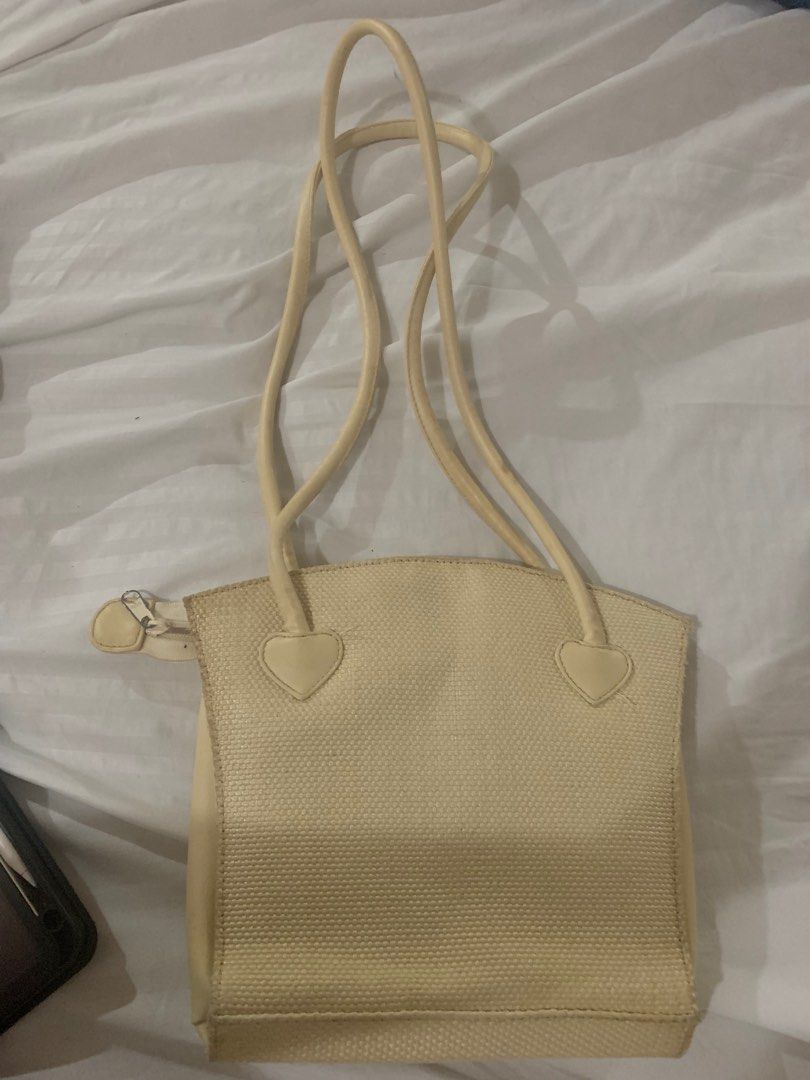 Bin Ron Yellow Cream Long Shoulder Bag (Category: Shoulder Bags) located in Manila. Submitted by mlbdll (Listing ID 1345494384, Image 2). Description: Bought this from an IG shop back then for 150 PHP but i havent used it once since it doesnt actually match what i usually wear (outfits) :( There are no flaws but it is indeed dirty so it needs cleaning If you want more pics of it, just dm me! :) .