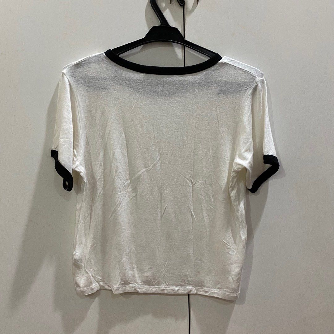 Brandy Melville White & Black Ringer Tee (Category: Shirts) located in Antipolo. Submitted by de.klutter (Listing ID 1345407776, Image 3). Description: Brandy Melville White & Black Ringer Tee CONDITION: Pre-loved, made of thin but very airy & comfortable fabric RFS: Decluttering PM for additional pics/info.