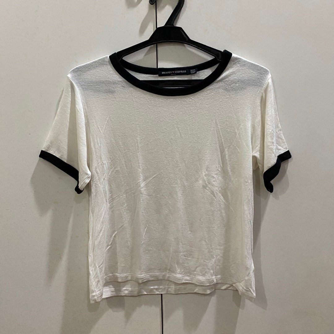 Brandy Melville White & Black Ringer Tee (Category: Shirts) located in Antipolo. Submitted by de.klutter (Listing ID 1345407776, Image 1). Description: Brandy Melville White & Black Ringer Tee CONDITION: Pre-loved, made of thin but very airy & comfortable fabric RFS: Decluttering PM for additional pics/info.