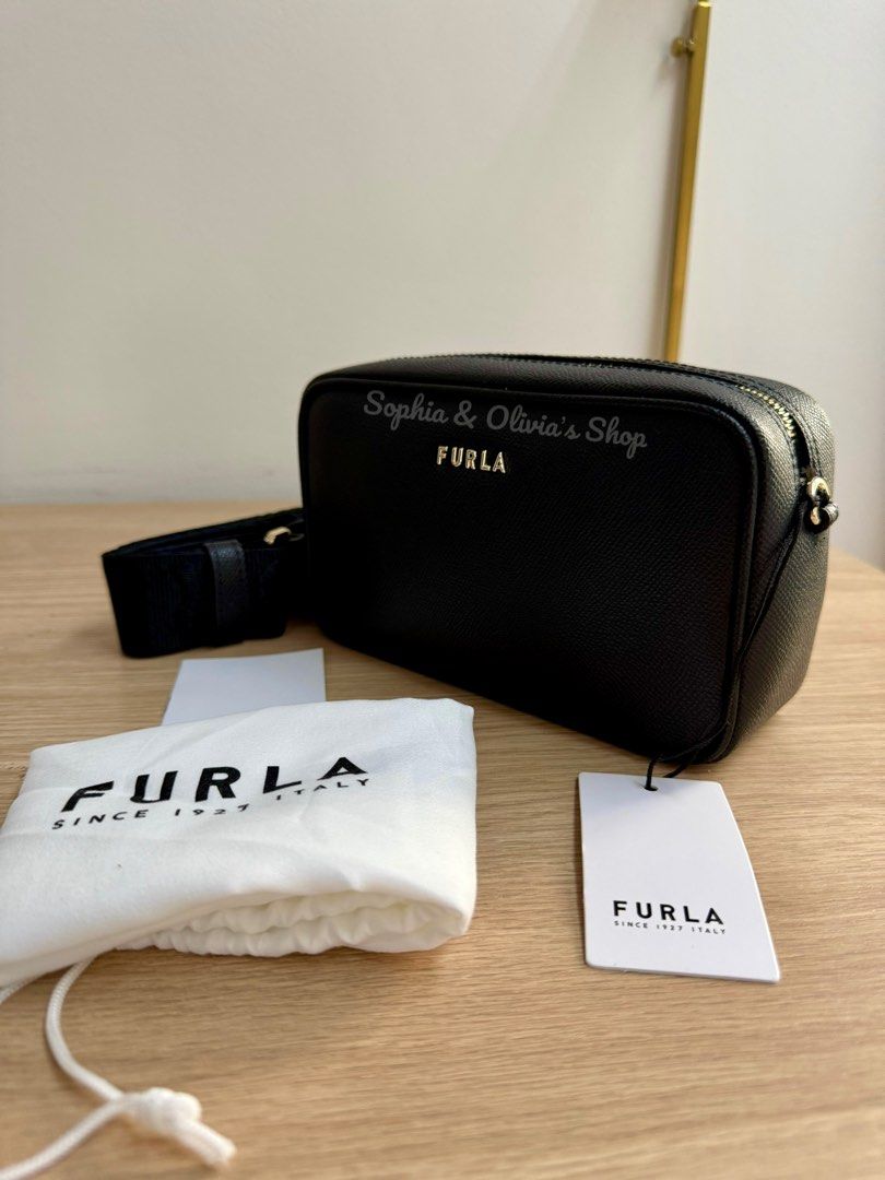 FURLA Camera Bag thick strap BLACK (Category: Luxury Bags & Wallets) located in Pasig City. Submitted by ellaandviashop (Listing ID 1345457876, Image 2). Description: 🇵🇭 On hand and ready to ship via lalamove/lbc 🇺🇸 Fresh arrivals 🆕 Authentic and brand new ✅ Comes with tag, some with care card, gift receipt, polyplastic 💳 Credit cards accepted .