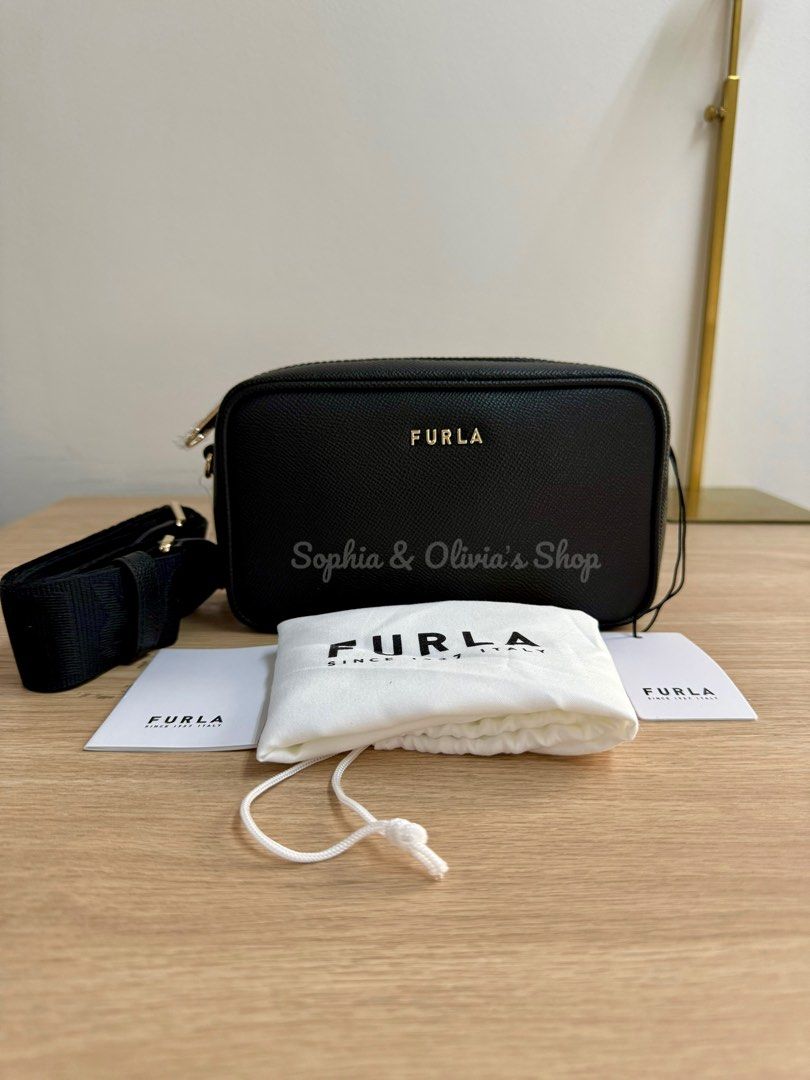 FURLA Camera Bag thick strap BLACK (Category: Luxury Bags & Wallets) located in Pasig City. Submitted by ellaandviashop (Listing ID 1345457876, Image 1). Description: 🇵🇭 On hand and ready to ship via lalamove/lbc 🇺🇸 Fresh arrivals 🆕 Authentic and brand new ✅ Comes with tag, some with care card, gift receipt, polyplastic 💳 Credit cards accepted .