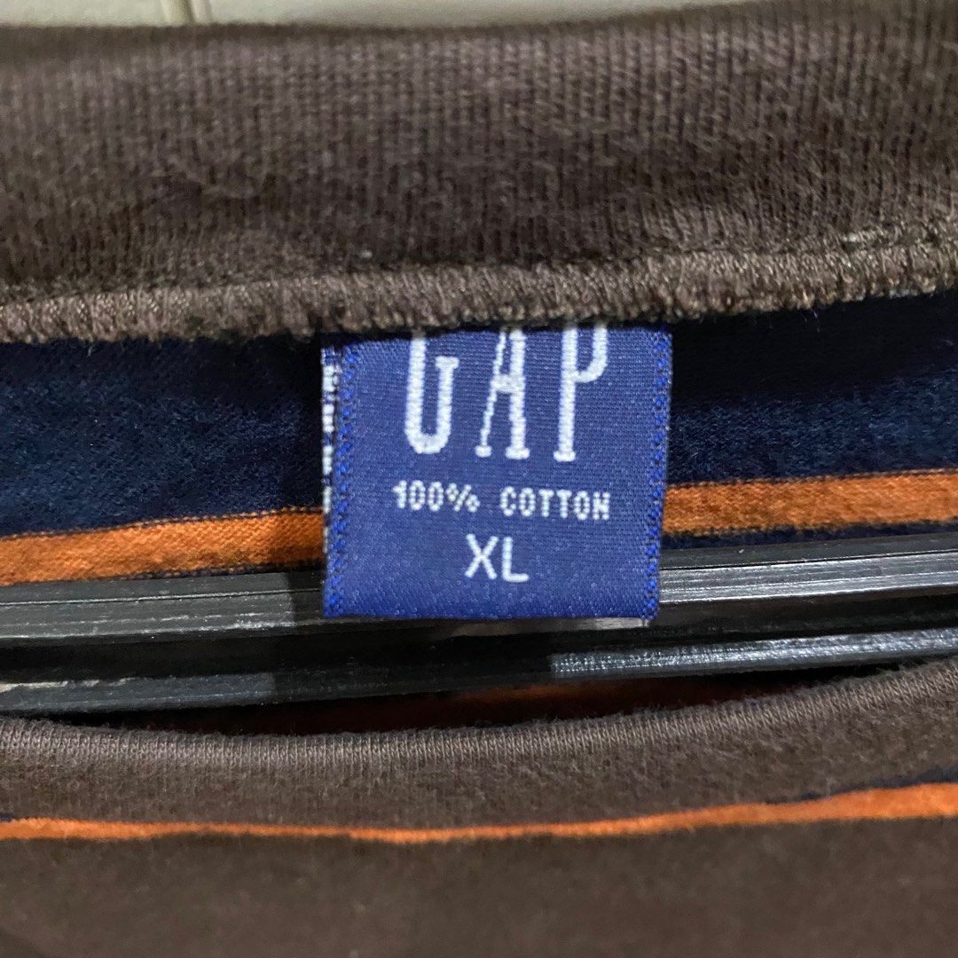 GAP Striped Cotton T-Shirt (Category: Tshirts & Polo Shirts ) located in Antipolo. Submitted by de.klutter (Listing ID 1345407285, Image 3). Description: GAP Striped 100% Cotton T-Shirt - Size: Men’s XL - Color: Vintage Brown, with red, orange & blue stripes - Authentic, gifted from the US CONDITION: 10/10, never worn. Thick, good quality cotton material RFS: Decluttering PM for additional pics/info.